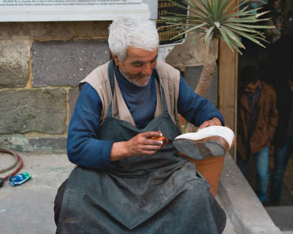 shoemaker working outdoors